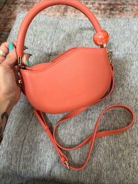 Melie Bianco Coral-Orange Crescent Mini Top Handle Bag